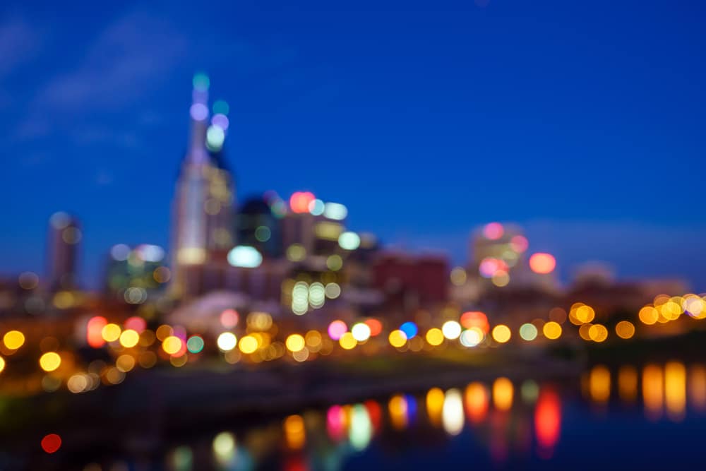 A blurred shot of the Nashville Skyline, including the famed Broadway Street