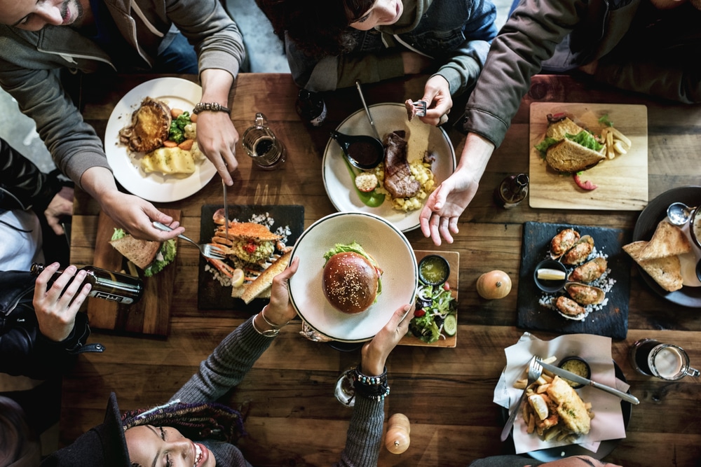 Germantown Restaurants in Nashville, photo of friends eating at a restaurant in Nashville